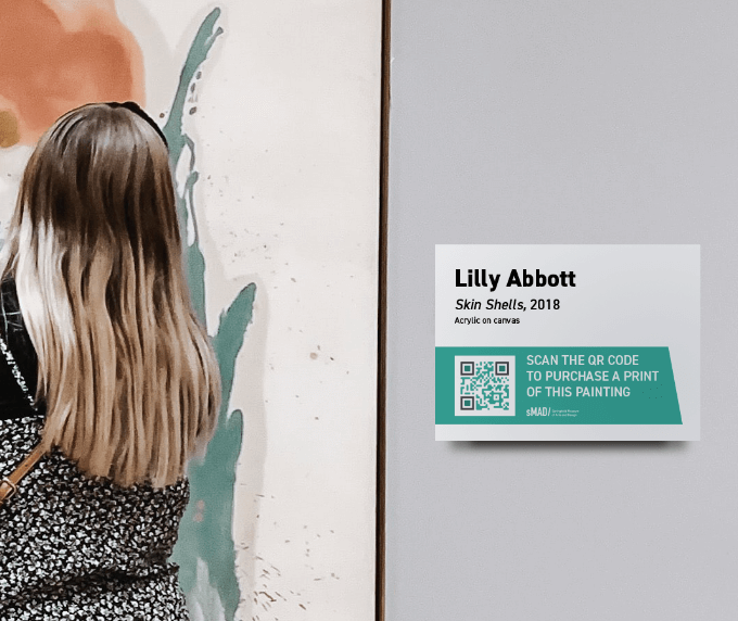 QR Code on object label encouraging visitors to purchase prints.